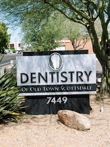 Dentistry of Old Town Scottsdale sign displaying office location at 7449 with desert landscaping.