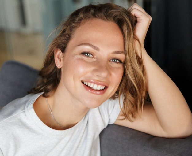 Smiling woman with glowing skin representing Botox cosmetic treatment services available at Dentistry of Old Town Scottsdale