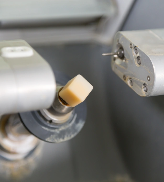 Close up of a CEREC milling tool creating a dental crown representing same day CEREC crown technology in Scottsdale