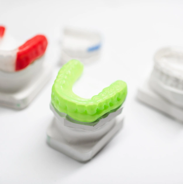 Colorful custom athletic mouthguards representing custom mouthguard services at Dentistry of Old Town Scottsdale