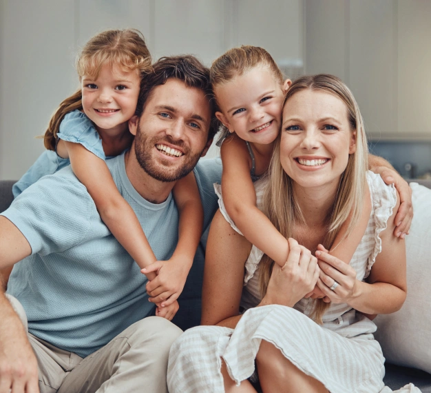 Happy family smiling together representing general and family dentistry services at Dentistry of Old Town Scottsdale