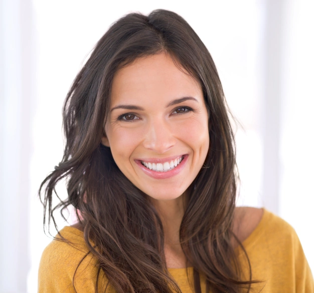 Smiling young woman representing internal tooth bleaching services at Dentistry of Old Town Scottsdale