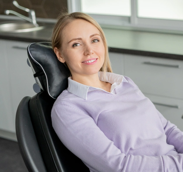 Female patient reclining comfortably in a dental chair representing oral surgery services at Dentistry of Old Town Scottsdale