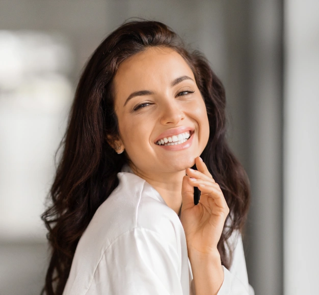 Smiling young woman representing periodontal care and gum health services at Dentistry of Old Town Scottsdale