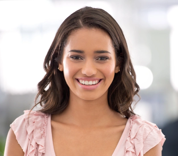 Smiling young woman representing post and core dental restoration services at Dentistry of Old Town Scottsdale
