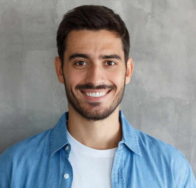 Smiling young man representing pulp regeneration dental services at Dentistry of Old Town Scottsdale