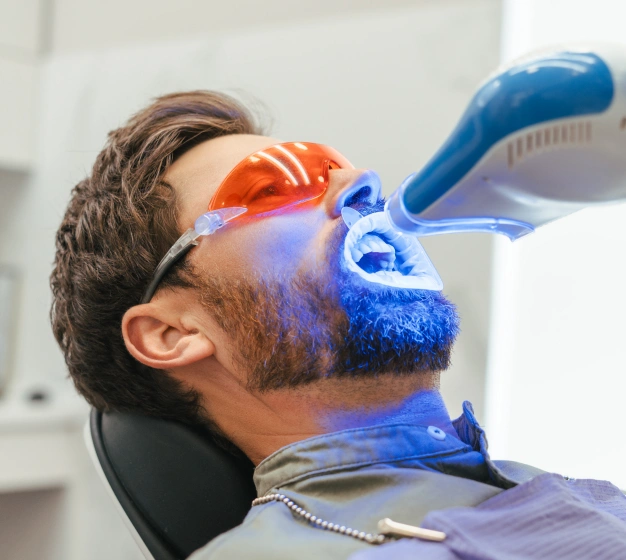 Patient wearing protective eyewear during an in office teeth whitening treatment in Scottsdale