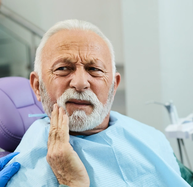 Older man with a beard representing tooth extraction services at Dentistry of Old Town Scottsdale