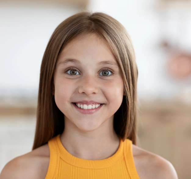 Smiling young woman representing vital pulp therapy and pulpotomy services at Dentistry of Old Town Scottsdale