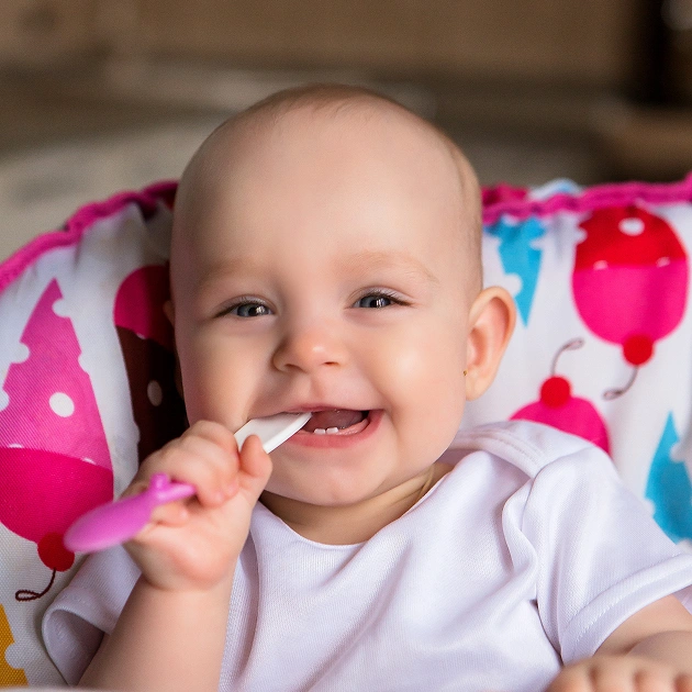 Smiling baby representing infant dentistry and early childhood dental care at Dentistry of Old Town Scottsdale