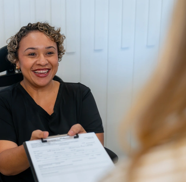 Smiling dental team member at Dentistry of Old Town Scottsdale representing the new patient welcome experience