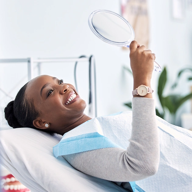 Female patient relaxing in a dental chair with NuCalm representing anxiety free sedation dentistry at Dentistry of Old Town Scottsdale