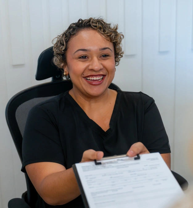 Smiling dental team member at Dentistry of Old Town Scottsdale representing patient forms and front desk services