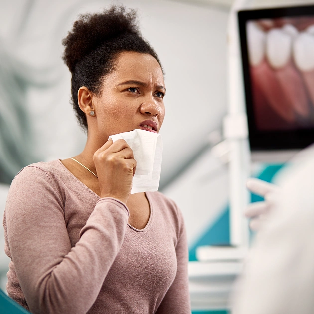 Female patient reviewing dental x rays with a dentist representing PerioProtect gum treatment at Dentistry of Old Town Scottsdale