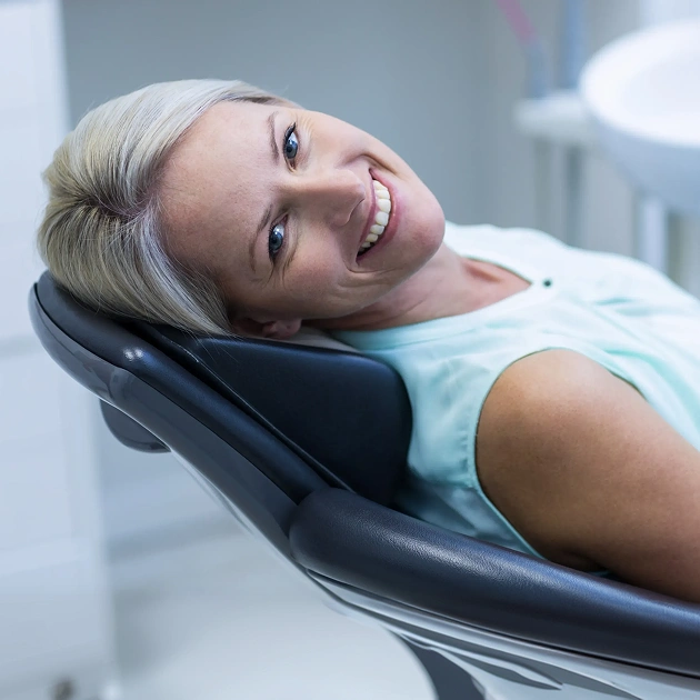 Relaxed female patient reclining in a dental chair representing sedation dentistry services at Dentistry of Old Town Scottsdale