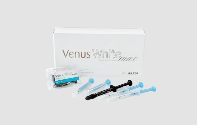 Venus White Max teeth whitening system featuring professional grade whitening gel and dental treatment accessories.