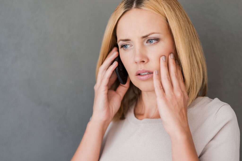 Patient calling an emergency dentist for Sudden Tooth Pain in Scottsdale, AZ